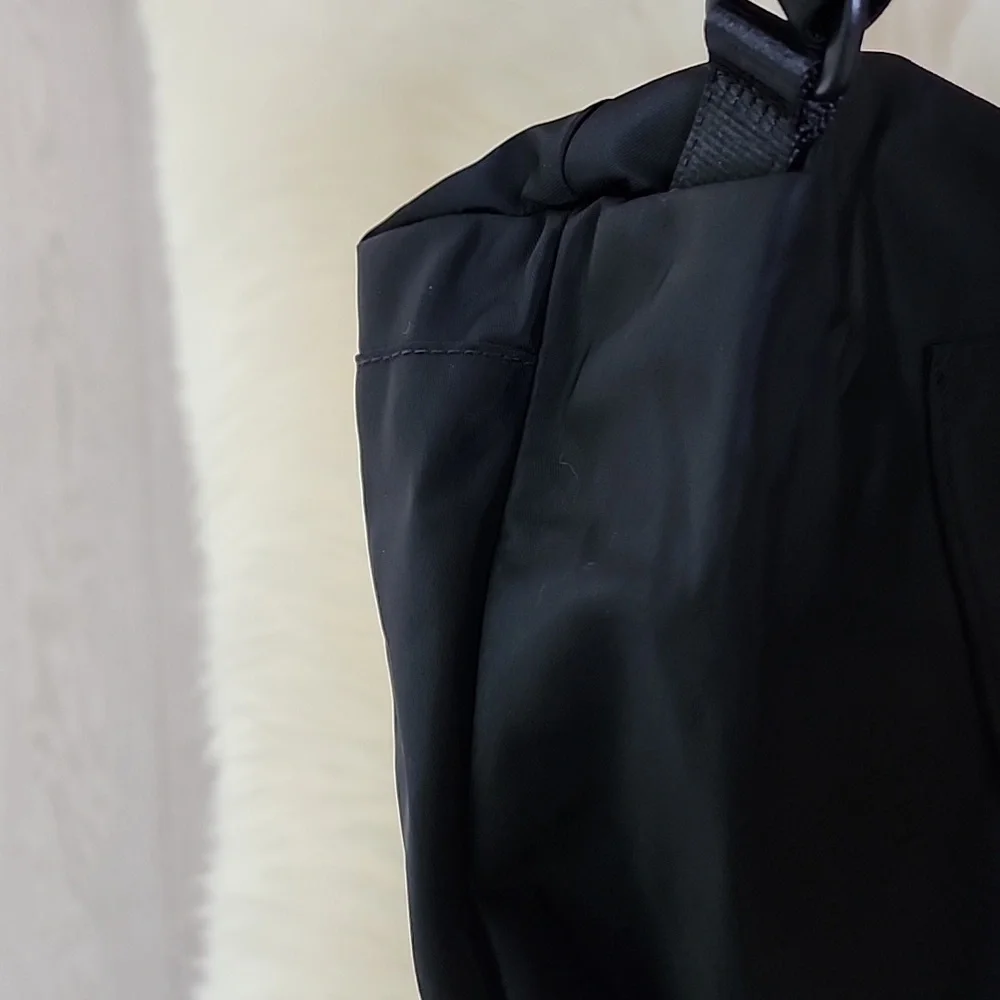 NWOT Tumi Just in Case Backpack in Black and Gold